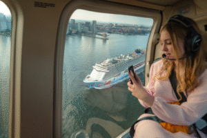 Woman in helicopter - cruise ship in background - hudson river